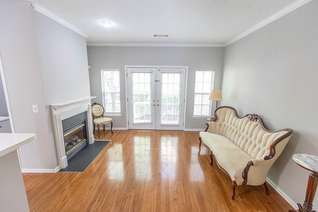 1731 Pryor Road Southwest, Unit 109 Atlanta, GA 30315 - Photo 13 of 34 a living room with furniture and a fireplace