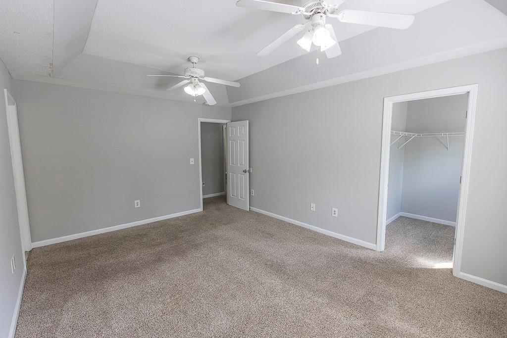 1731 Pryor Road Southwest, Unit 109 Atlanta, GA 30315 - Photo 18 of 34 an empty room and chandelier fan