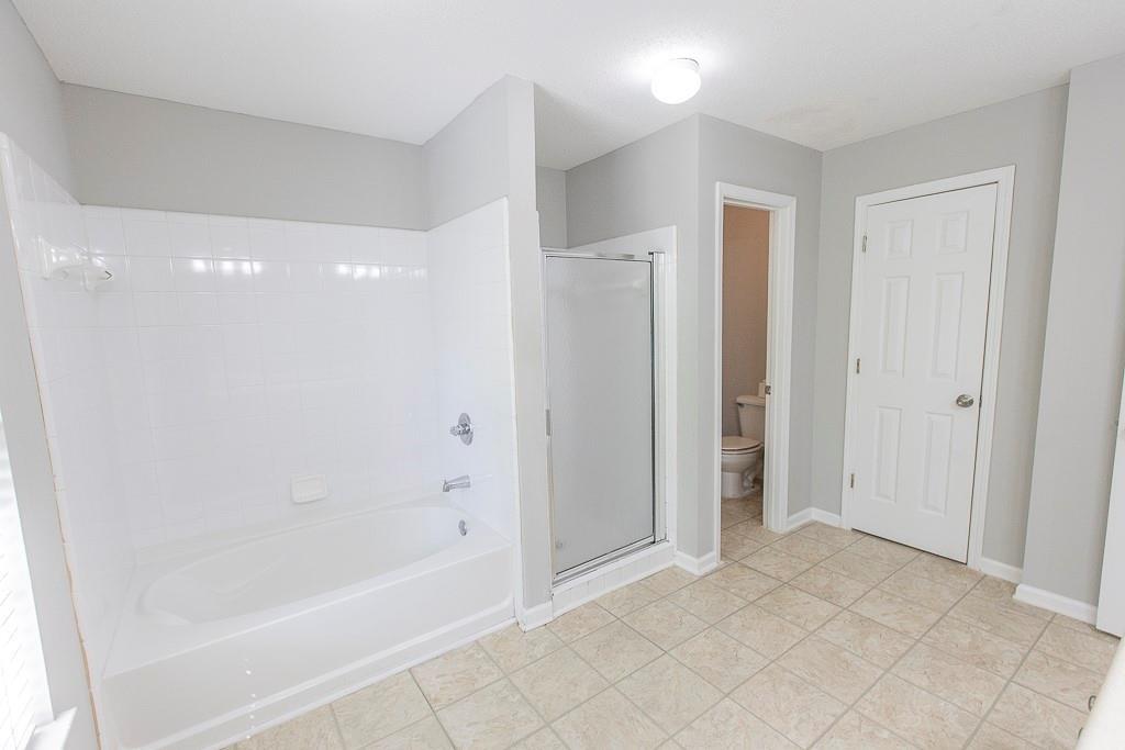 1731 Pryor Road Southwest, Unit 109 Atlanta, GA 30315 - Photo 22 of 34 a bathroom with a bathtub and a shower