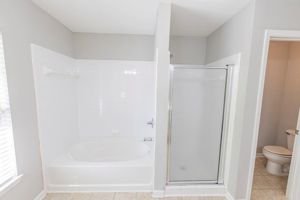 1731 Pryor Road Southwest, Unit 109 Atlanta, GA 30315 - Photo 23 of 34 a bathroom with a shower and a toilet