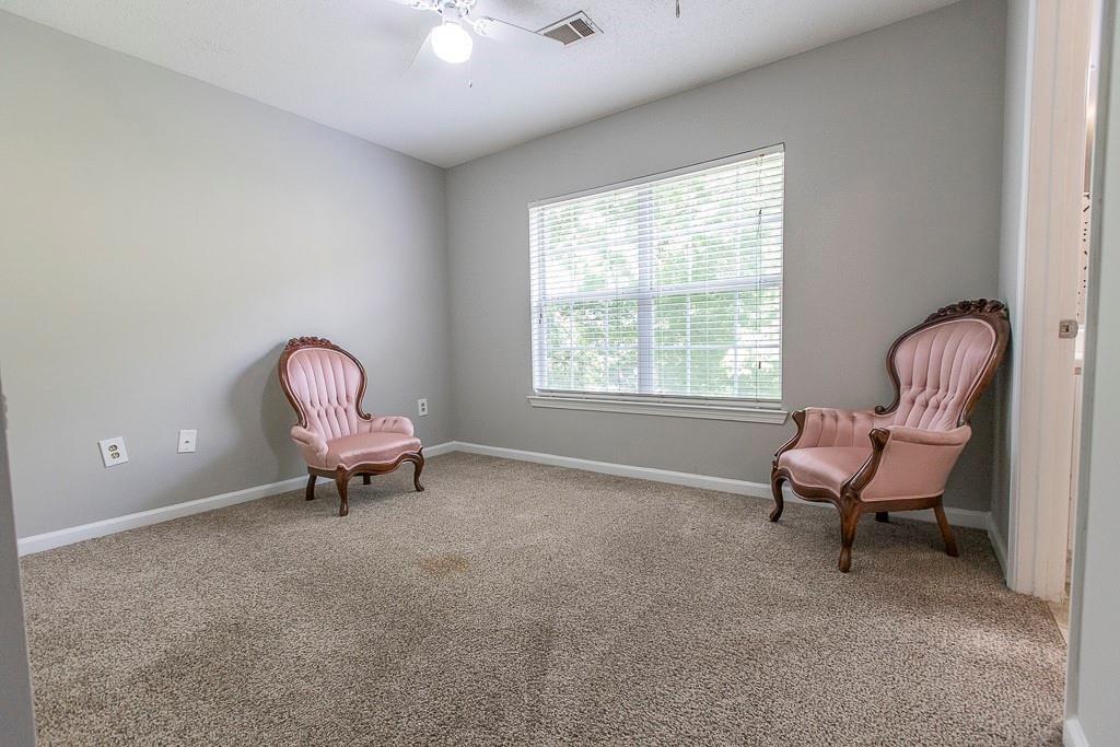 1731 Pryor Road Southwest, Unit 109 Atlanta, GA 30315 - Photo 30 of 34 a living room with furniture and a window