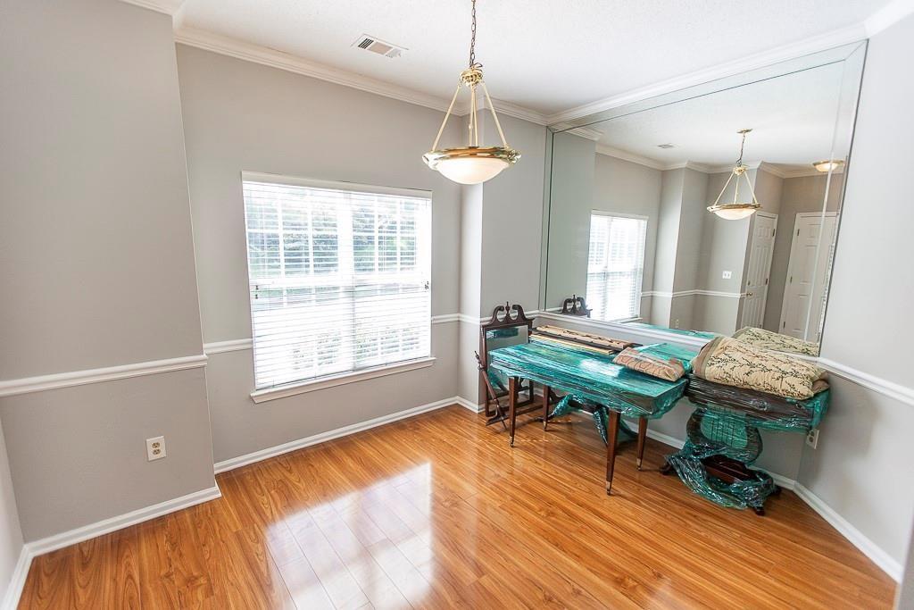 1731 Pryor Road Southwest, Unit 109 Atlanta, GA 30315 - Photo 3 of 34 a room with a table chairs and entryway