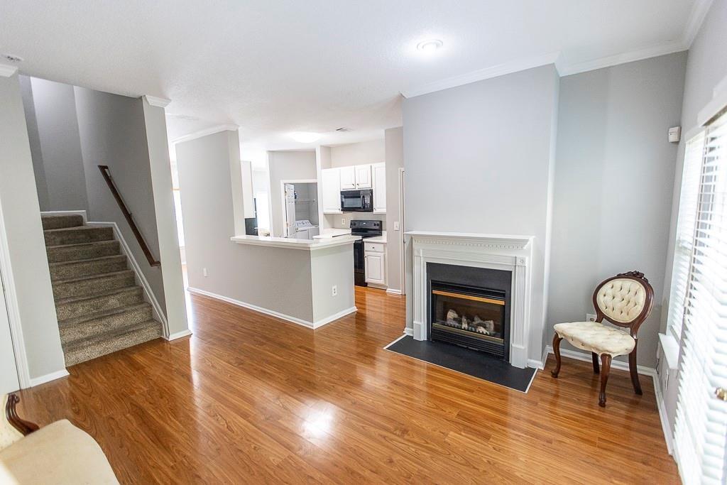 1731 Pryor Road Southwest, Unit 109 Atlanta, GA 30315 - Photo 8 of 34 a living room with furniture and a fireplace