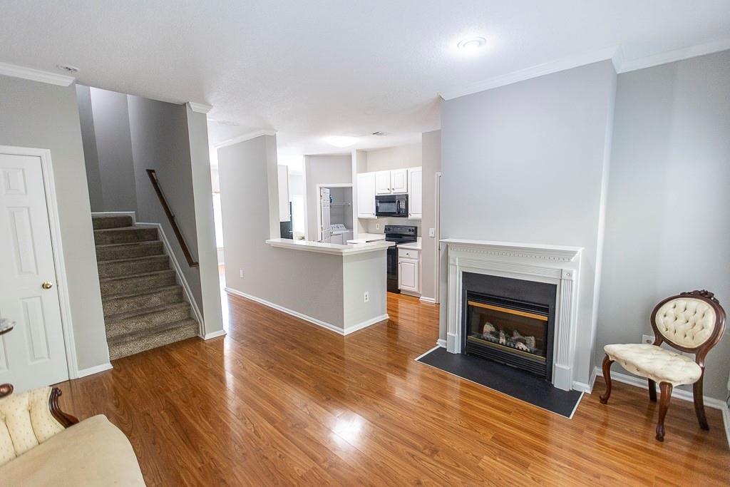 1731 Pryor Road Southwest, Unit 109 Atlanta, GA 30315 - Photo 9 of 34 a living room with furniture and a fireplace