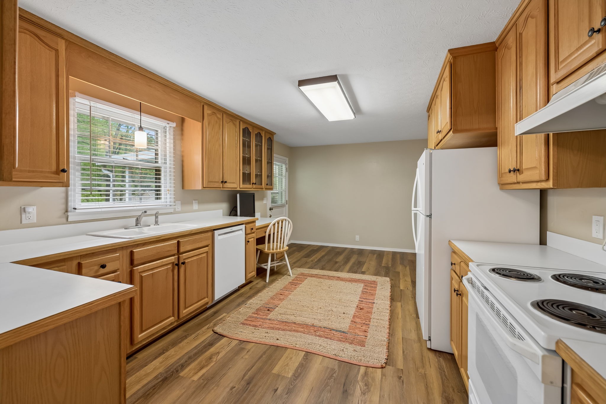 1343 Whiteaker Springs Road Cookeville, TN 38506 - Photo 17 of 48 a kitchen with a stove a sink and a refrigerator