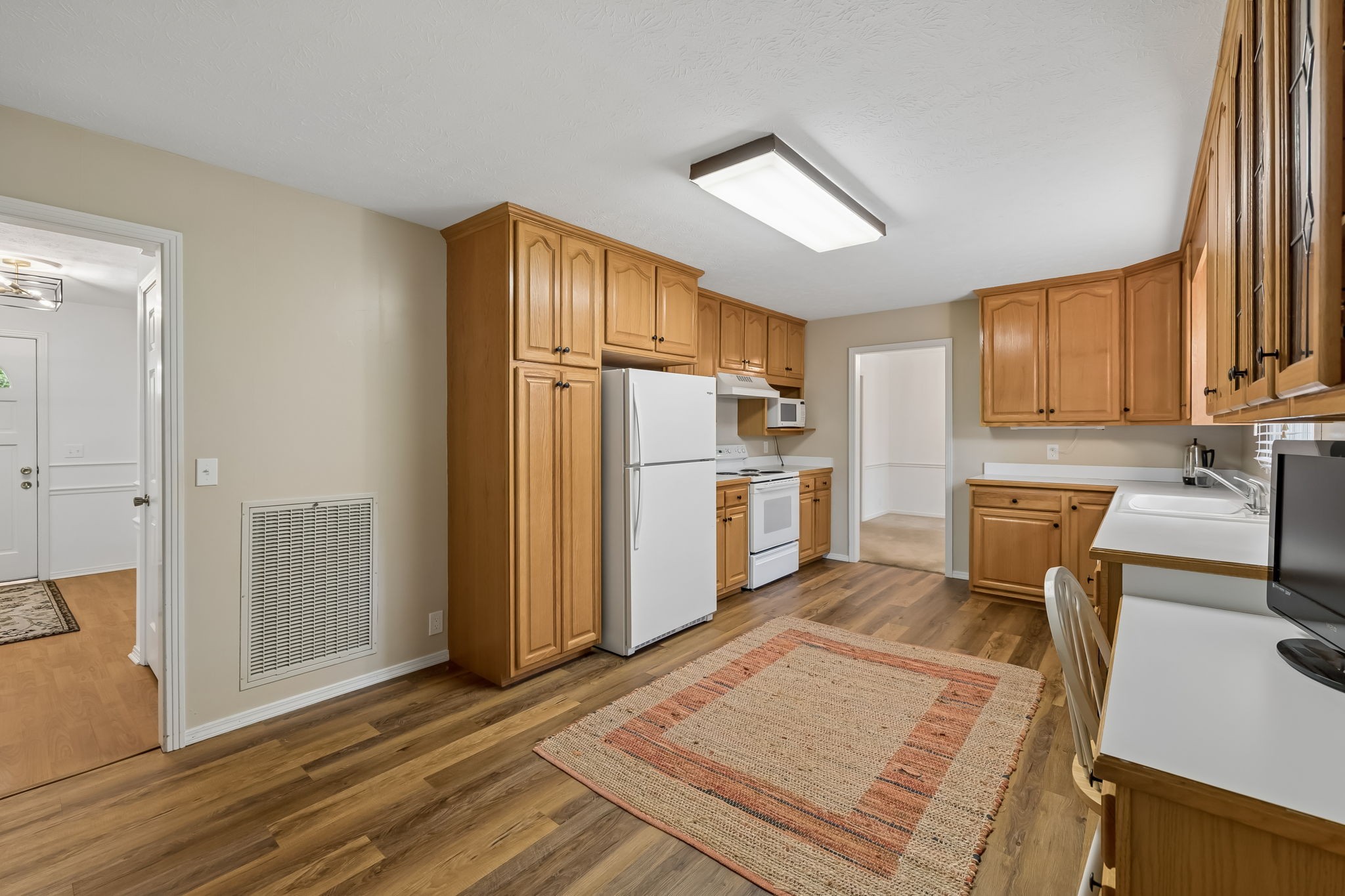 1343 Whiteaker Springs Road Cookeville, TN 38506 - Photo 19 of 48 a kitchen with white cabinets and stainless steel appliances