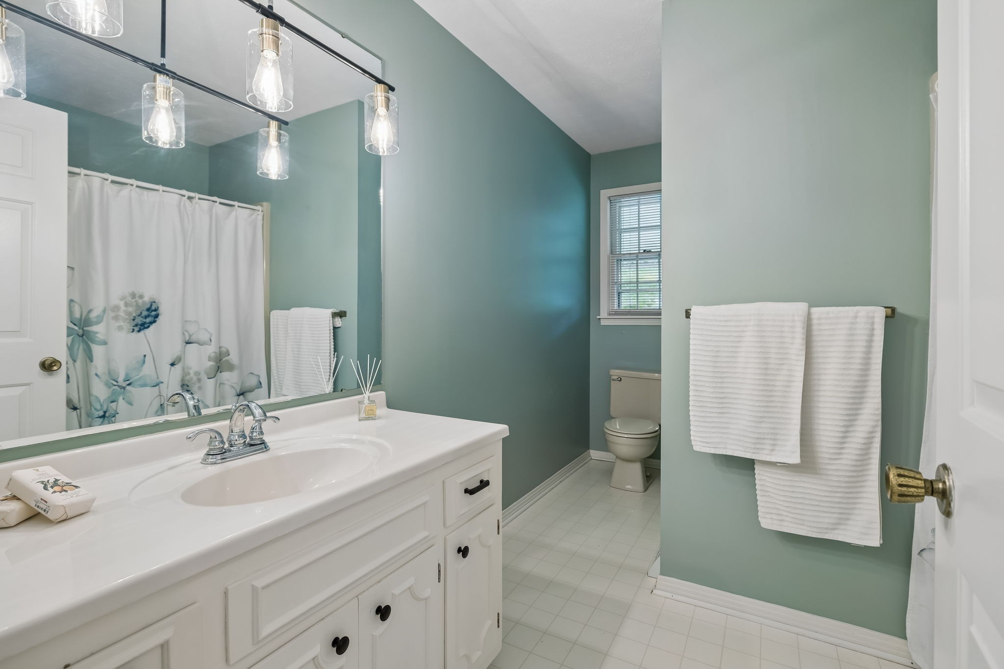 1343 Whiteaker Springs Road Cookeville, TN 38506 - Photo 23 of 48 a bathroom with a sink and a mirror