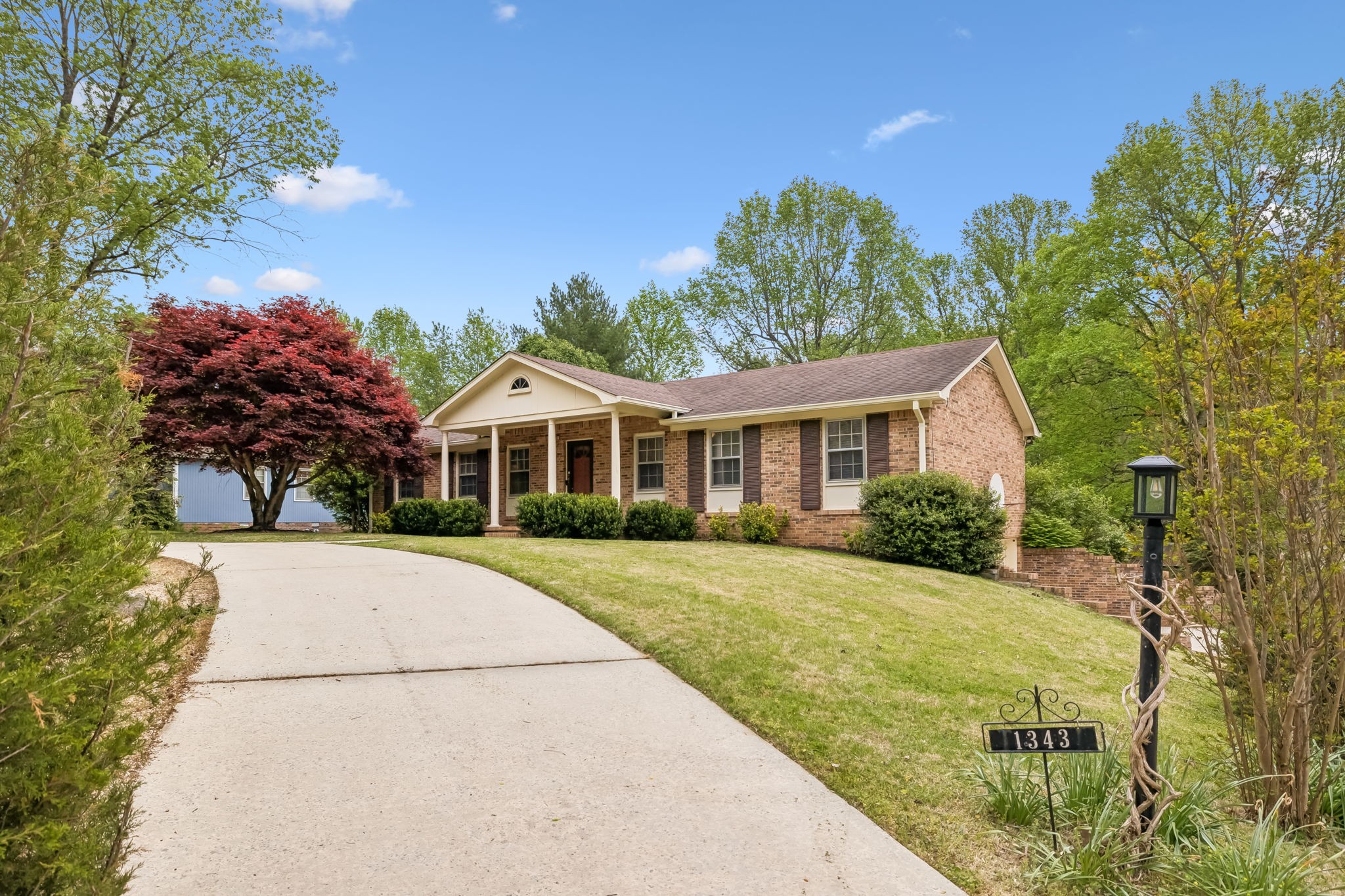 1343 Whiteaker Springs Road Cookeville, TN 38506 - Photo 4 of 48 a front view of a house with a yard