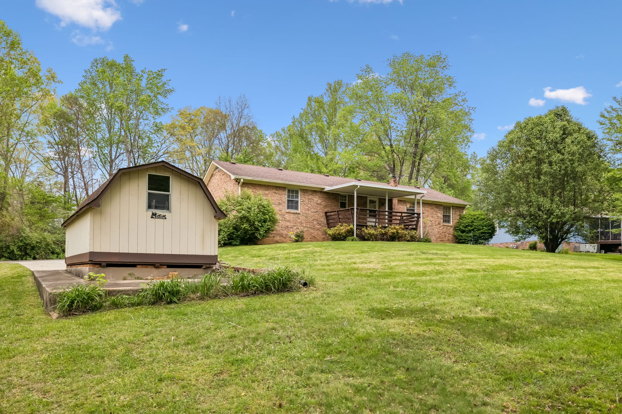 1343 Whiteaker Springs Road Cookeville, TN 38506 - Photo 47 of 48 a front view of a house with a yard and trees