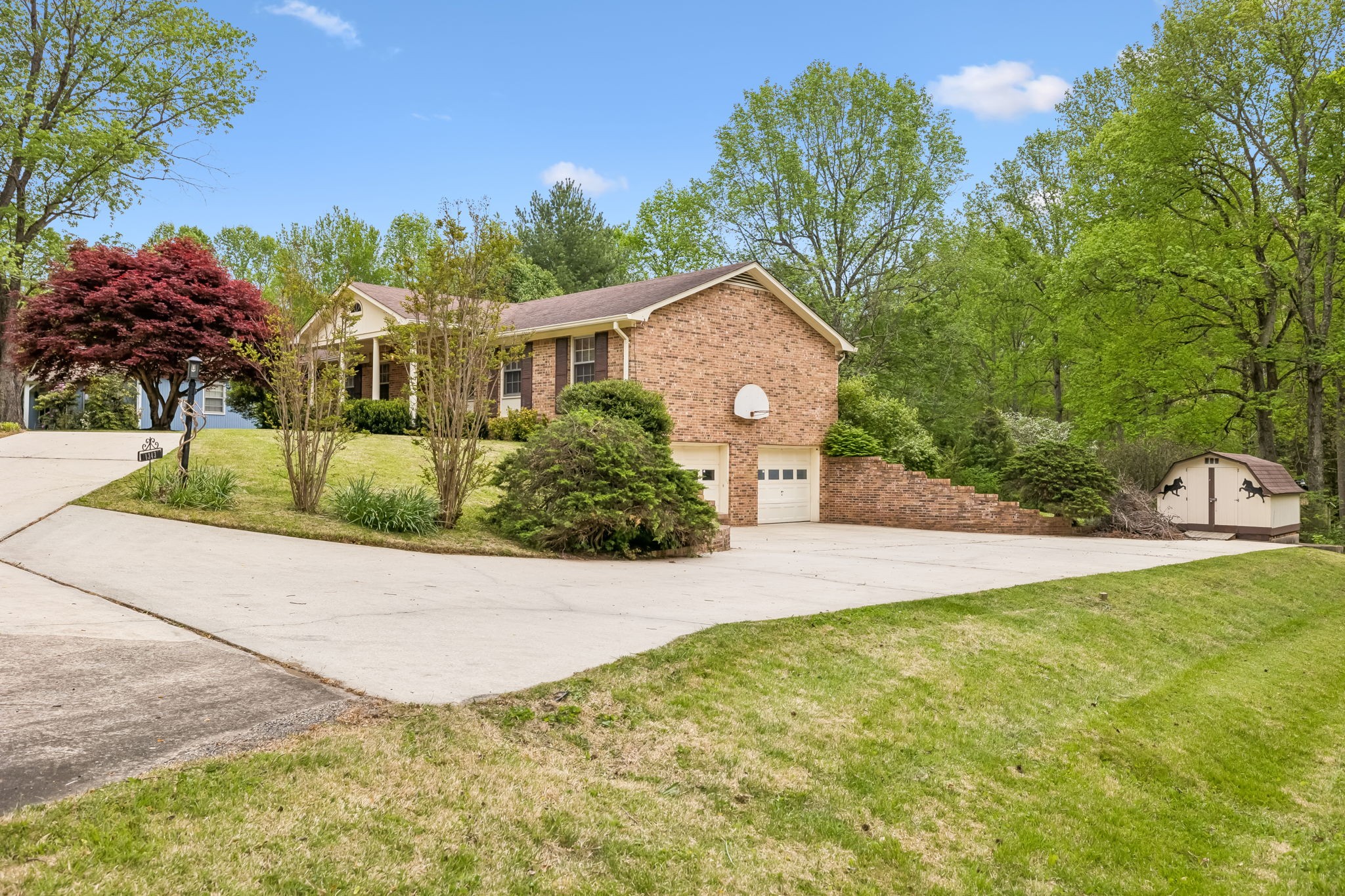 1343 Whiteaker Springs Road Cookeville, TN 38506 - Photo 5 of 48 a front view of a house with a yard and trees