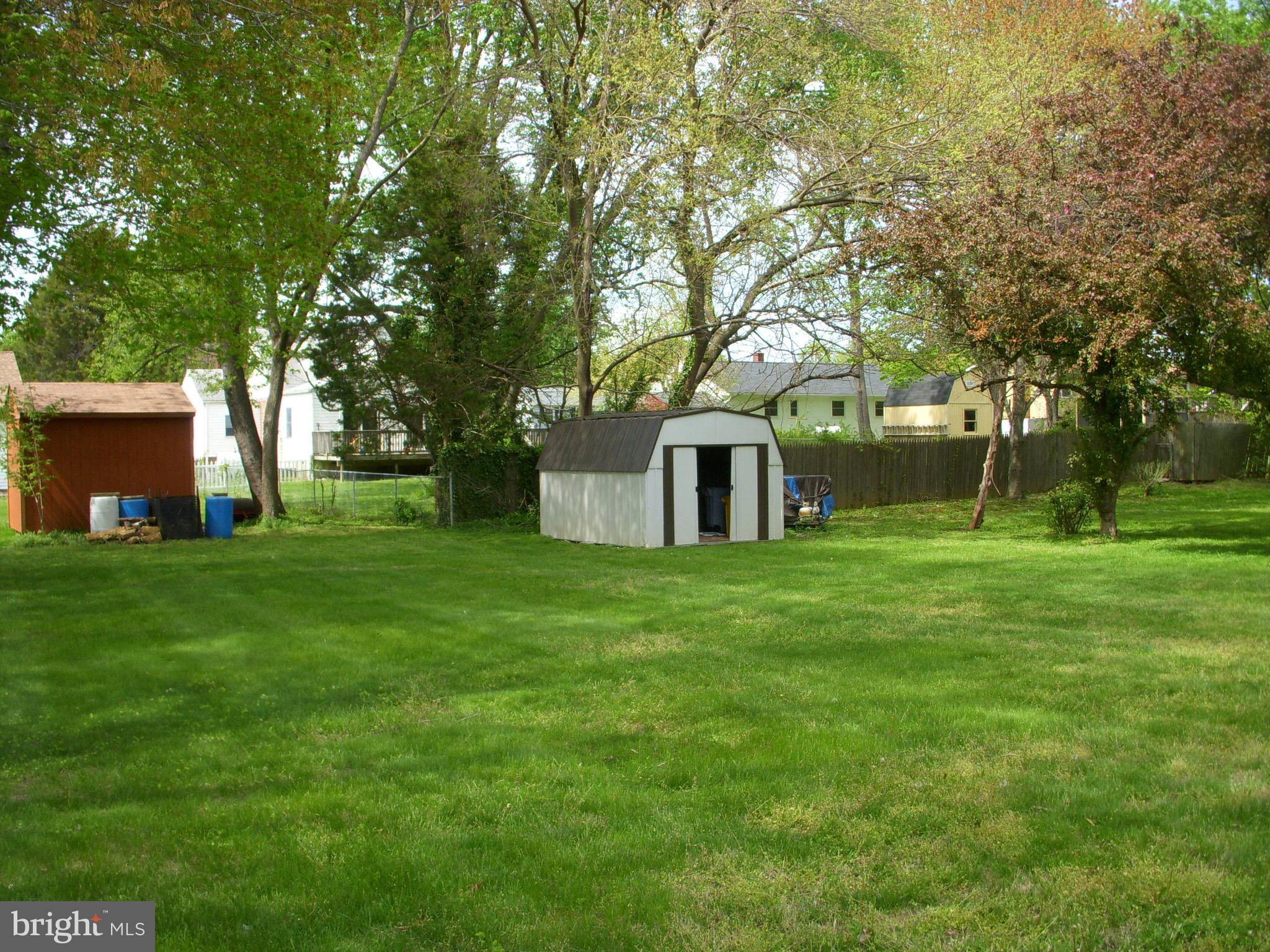 106 Boyd Drive Annapolis, MD 21403 - Photo 2 of 7 a front view of a house with a garden and trees