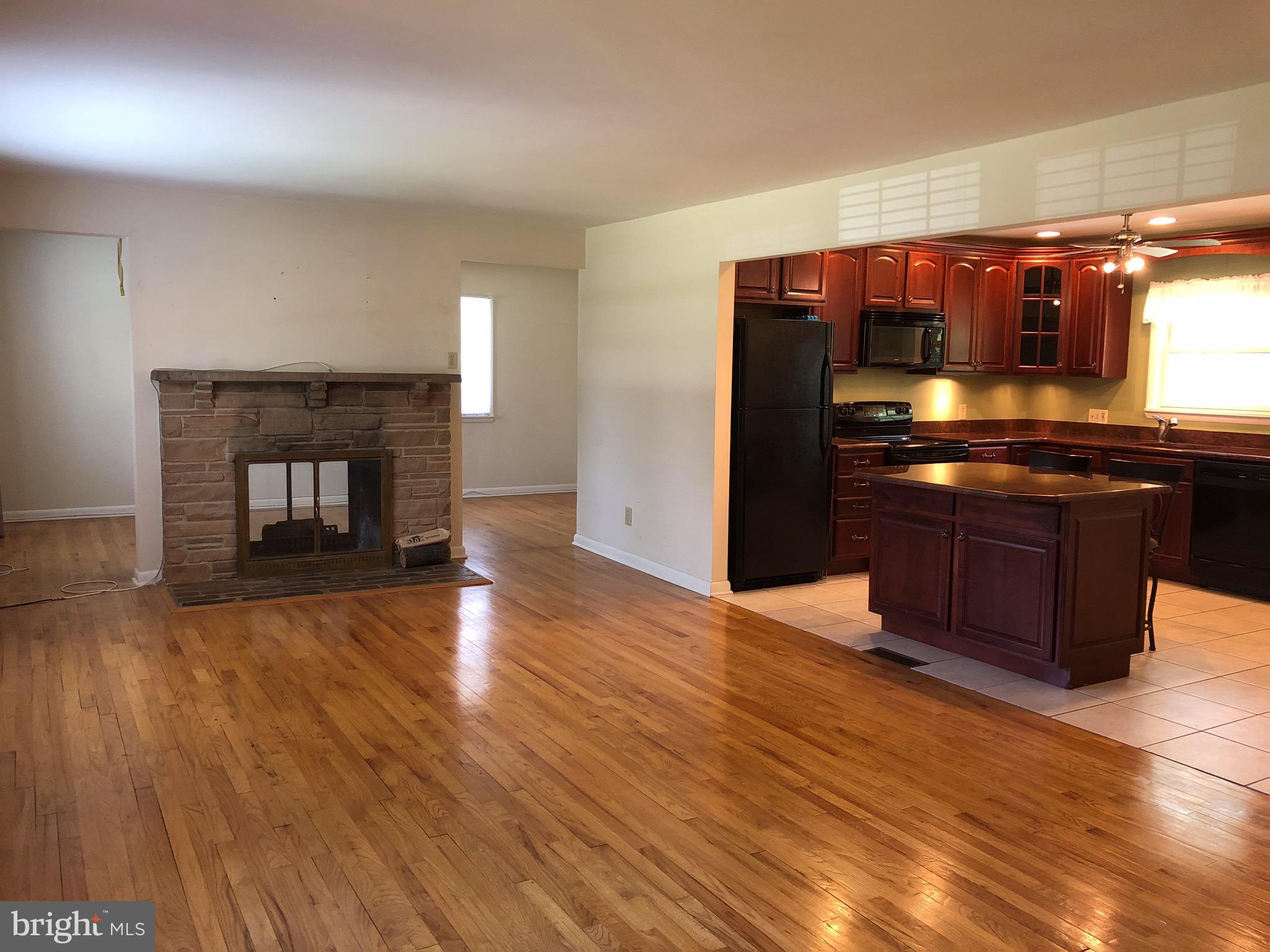 106 Boyd Drive Annapolis, MD 21403 - Photo 4 of 7 a kitchen with stainless steel appliances granite countertop a stove and a wooden floors