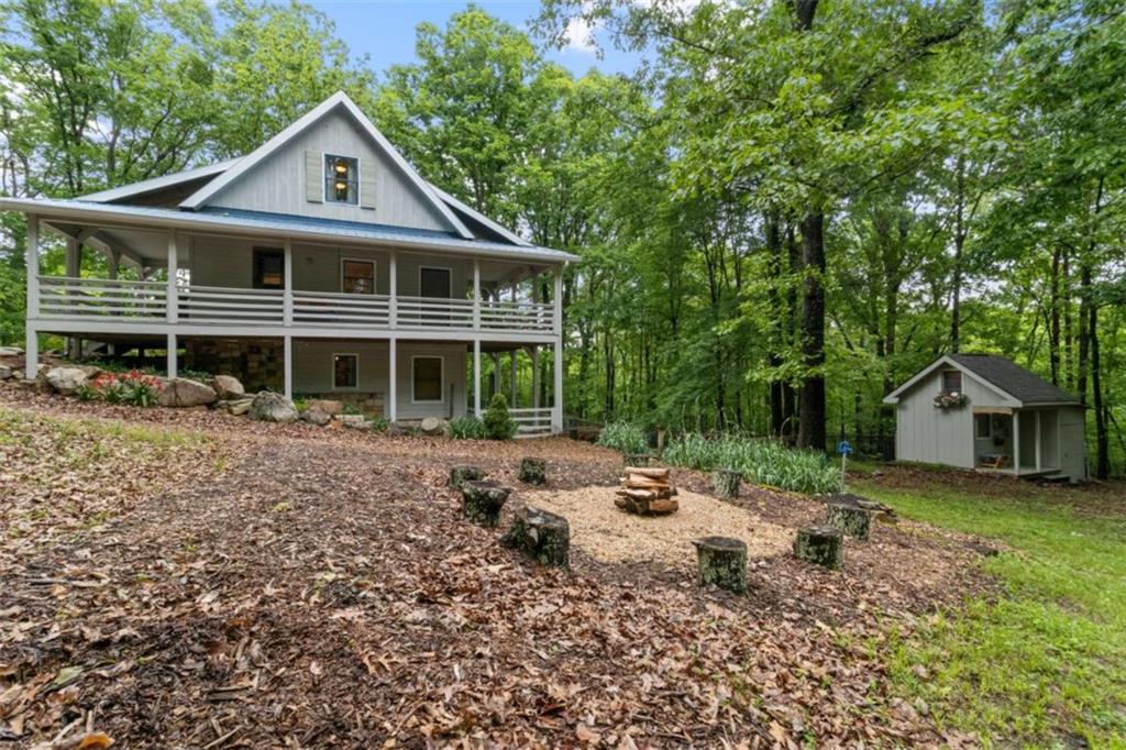 219 Raven Cliff Road Talking Rock, GA 30175 - Photo 54 of 77 a front view of a house with a yard