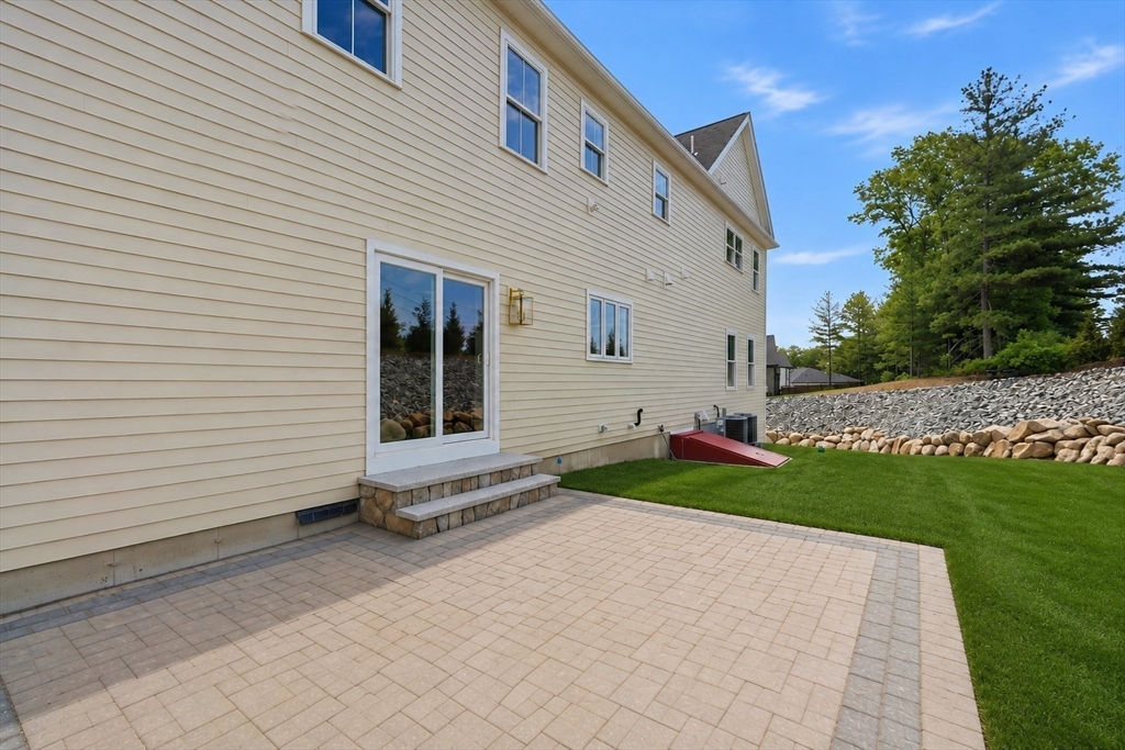 16 Couture Way Middleton, MA 01949 - Photo 35 of 36 a front view of a house with a yard