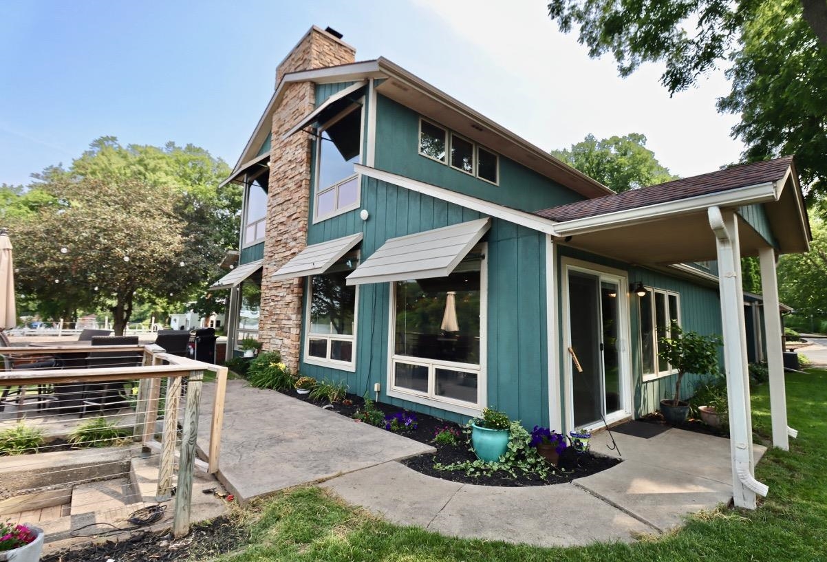 2870 South Riverside Drive Beloit, WI 53511 - Photo 2 of 32 a front view of a house with garden
