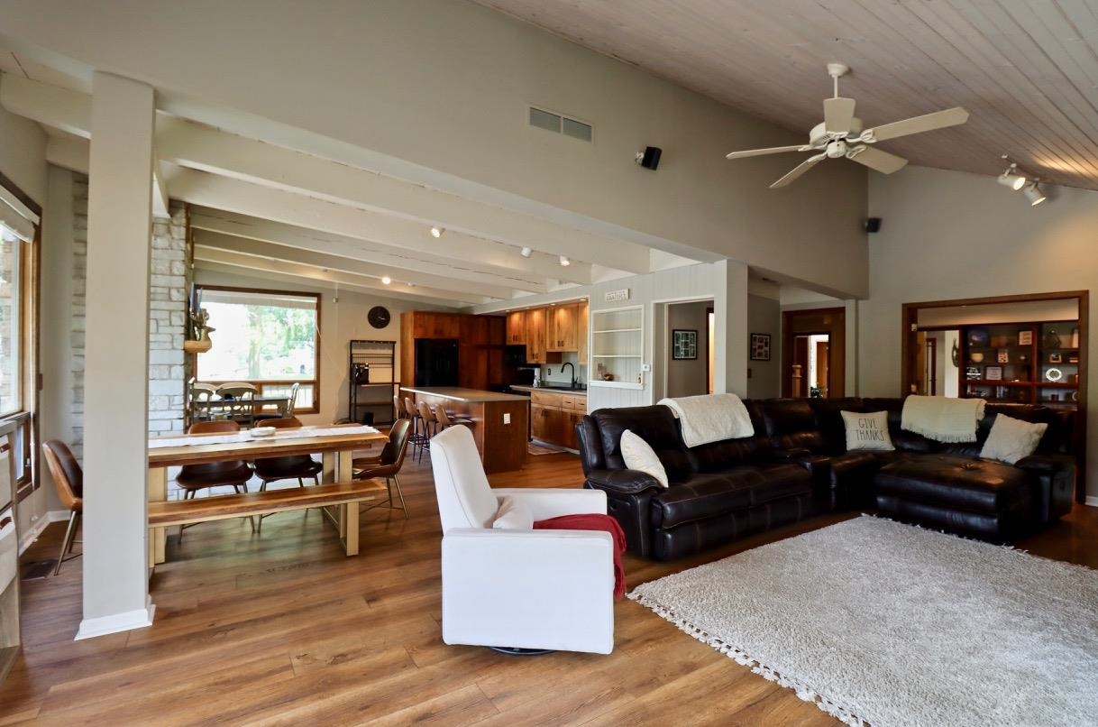 2870 South Riverside Drive Beloit, WI 53511 - Photo 21 of 32 a living room with furniture and a wooden floor