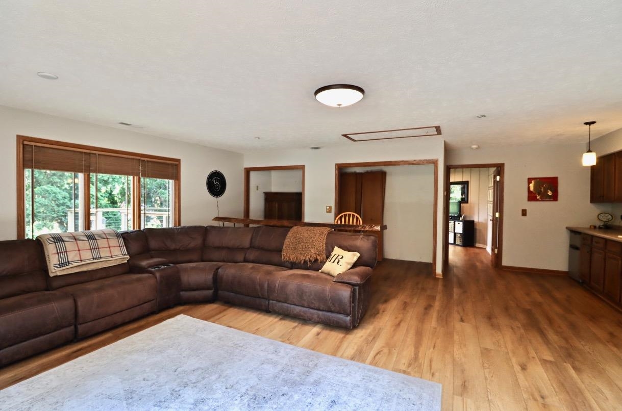 2870 South Riverside Drive Beloit, WI 53511 - Photo 24 of 32 a living room with furniture and a wooden floor