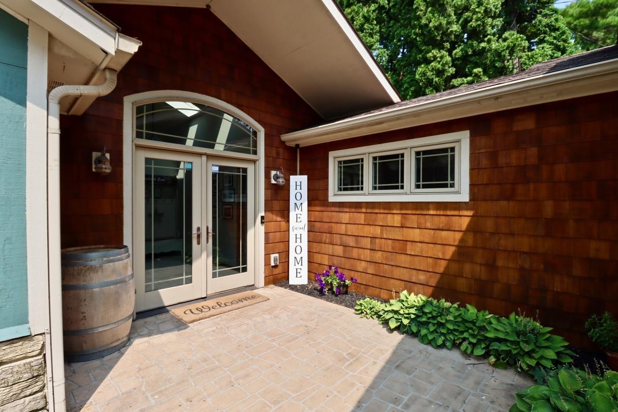 2870 South Riverside Drive Beloit, WI 53511 - Photo 29 of 32 a view of a house with a backyard porch