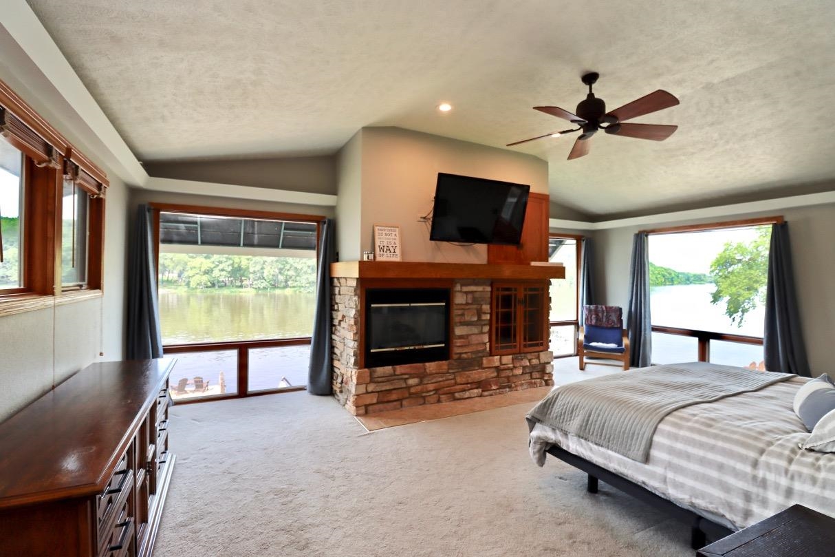 2870 South Riverside Drive Beloit, WI 53511 - Photo 10 of 32 a bedroom with a bed and a flat screen tv