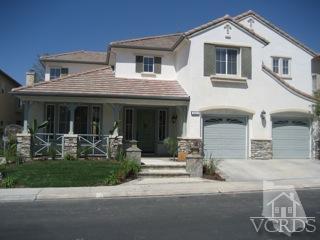 5813 Indian Pointe Drive Simi Valley, CA 93063 - Photo 1 of 25 a front view of a house with garden and porch