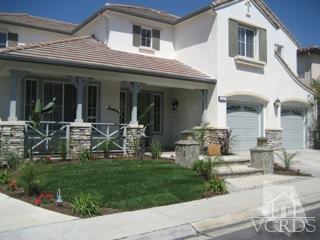 5813 Indian Pointe Drive Simi Valley, CA 93063 - Photo 2 of 25 a front view of a house with a garden and pathway