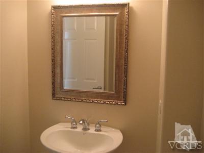 5813 Indian Pointe Drive Simi Valley, CA 93063 - Photo 15 of 25 a bathroom with a sink and a mirror