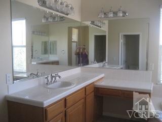 5813 Indian Pointe Drive Simi Valley, CA 93063 - Photo 18 of 25 a bathroom with a sink and a mirror