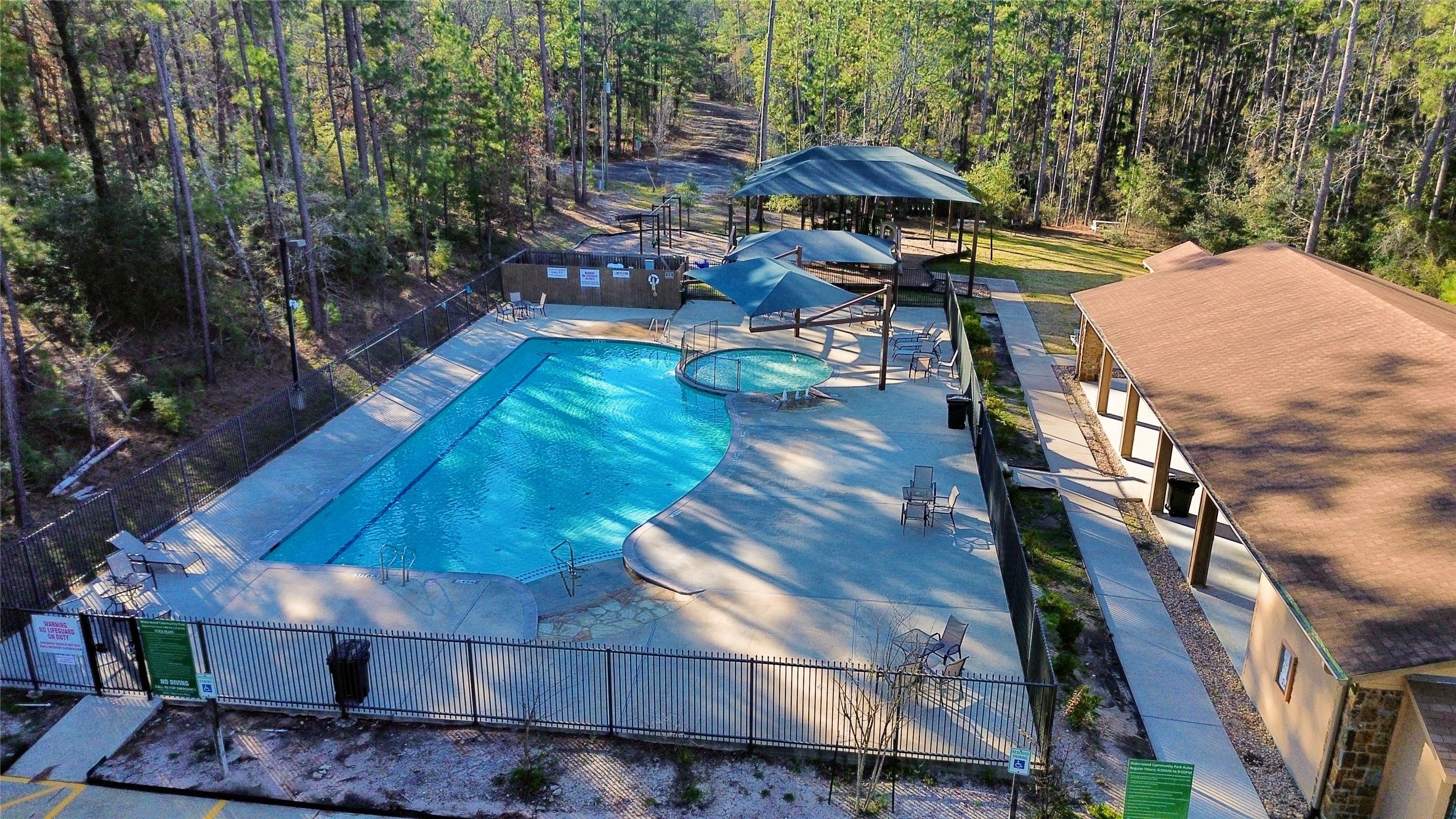 8 Walnut Court Oakhurst, TX 77359 - Photo 2 of 4 a view of a patio with furniture and backyard