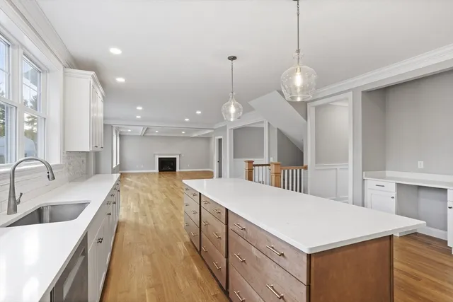 a bathroom with a toilet a sink a vanity and mirror