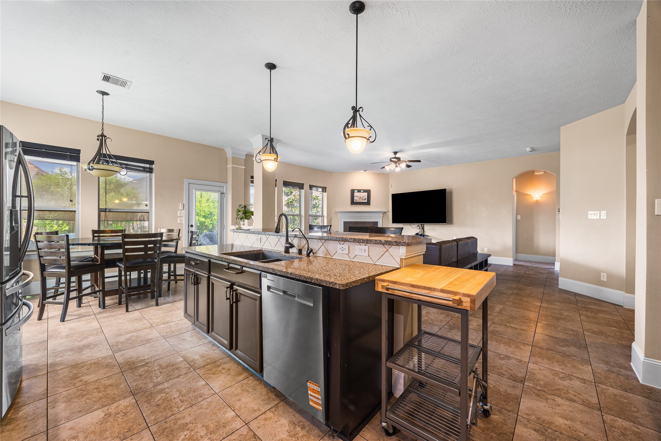 31311 Brighton Brook Lane Spring, TX 77386 - Photo 12 of 47 Spacious open-concept design combining the kitchen, breakfast area, and living room for easy everyday living and entertaining.