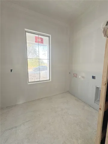 an empty room with a empty space and windows