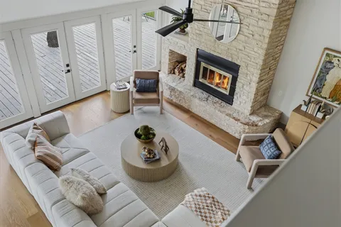 a living room with furniture and wooden floor