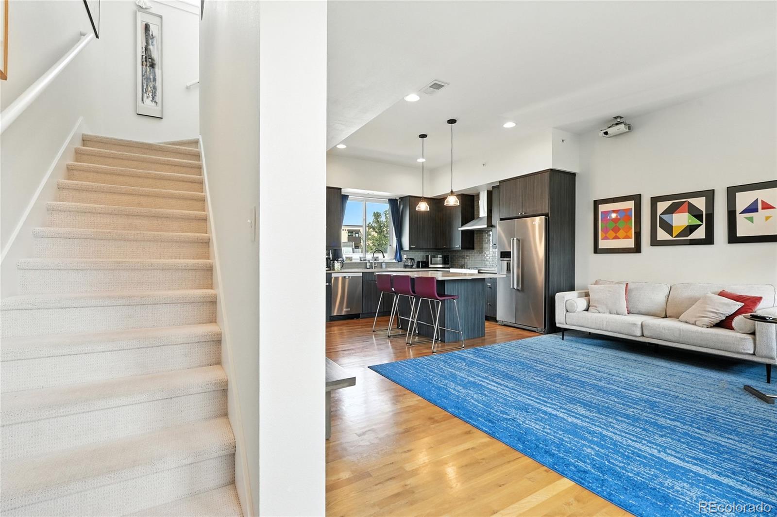 2530 28th Street, Unit 118 Boulder, CO 80301 - Photo 12 of 30 a living room with furniture and kitchen view
