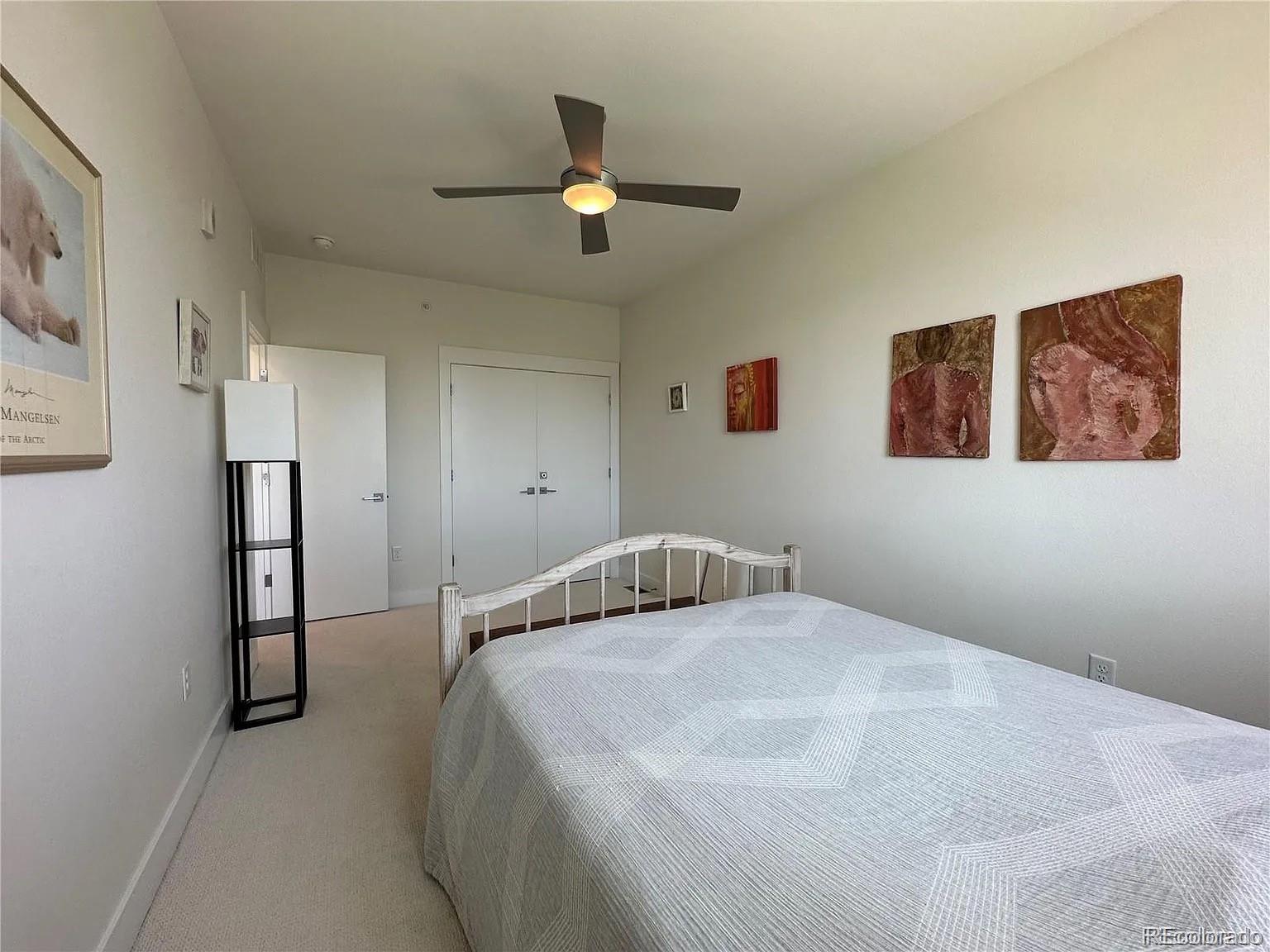 2530 28th Street, Unit 118 Boulder, CO 80301 - Photo 15 of 30 a bedroom with a bed and a painting on the wall