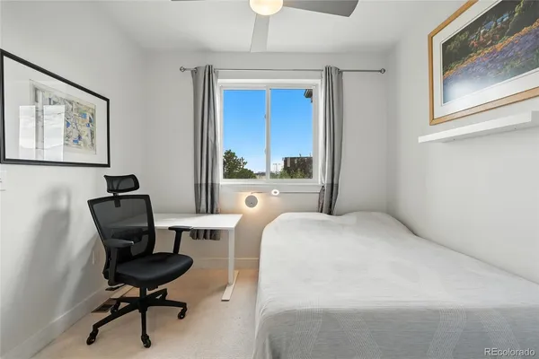 a workspace with furniture and a window