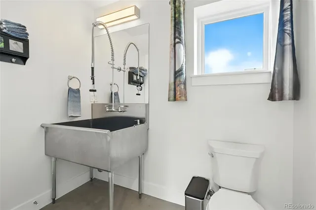 a bathroom with a sink vanity and a mirror