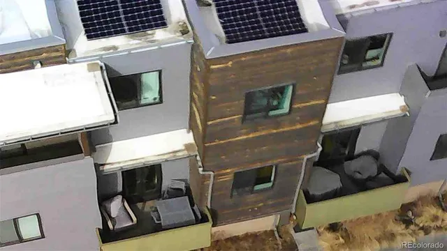 a view of a building with a backyard