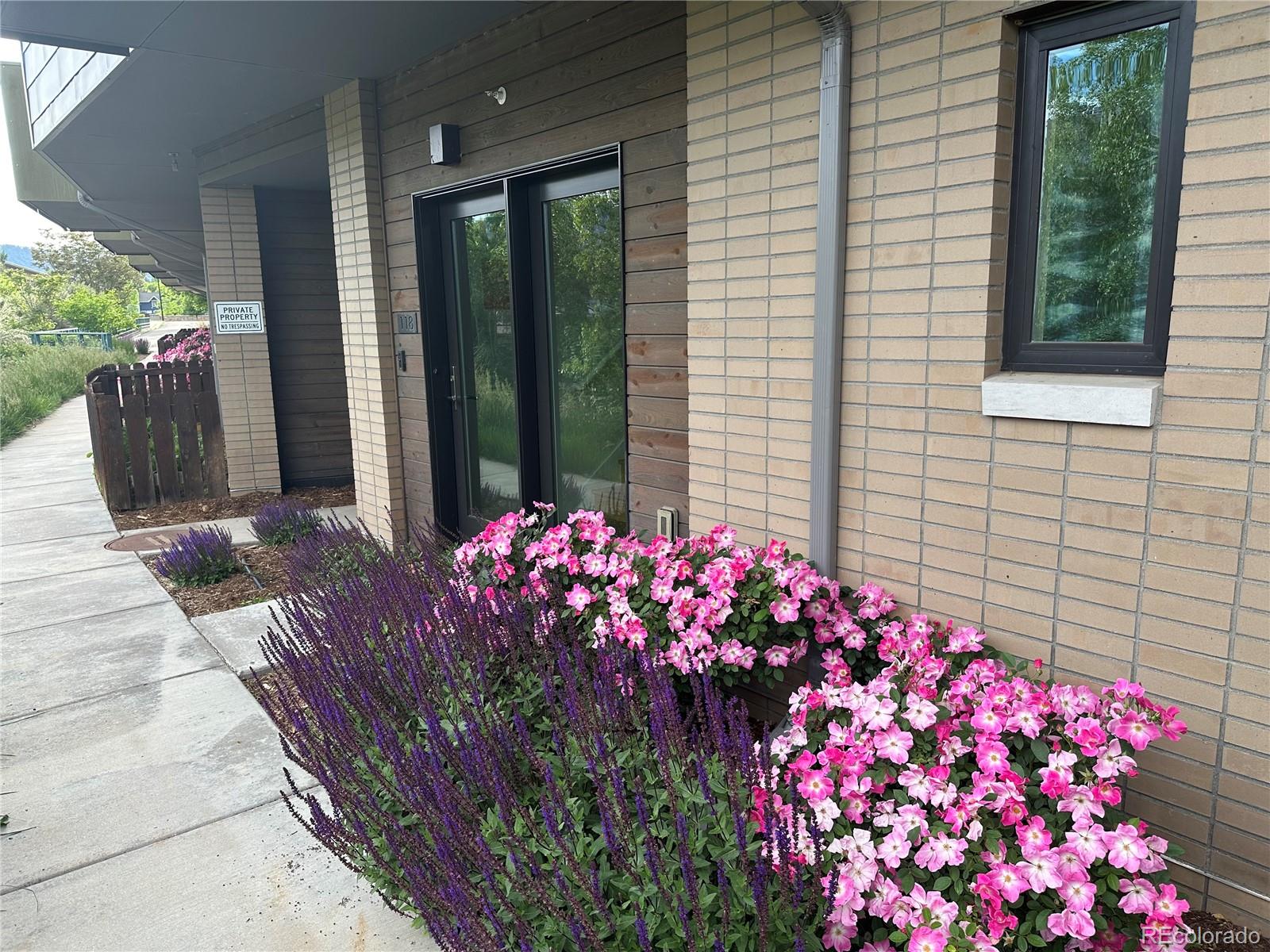 2530 28th Street, Unit 118 Boulder, CO 80301 - Photo 3 of 30 a view of a potted flower in front of door