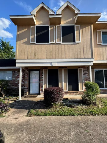 a front view of a house with yard