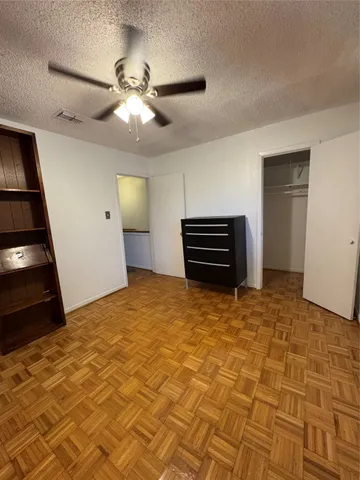 a view of an empty room and a window