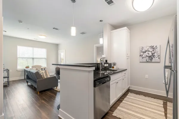 a kitchen with sink and cabinets