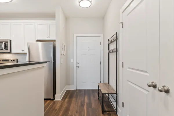 a view of a kitchen from the hallway