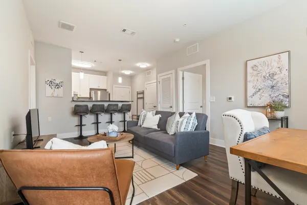 a living room with furniture and a table