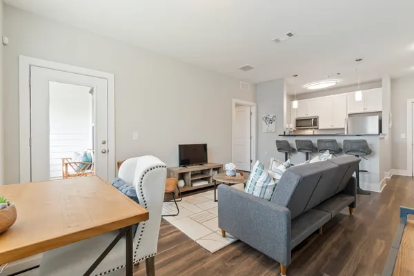 a living room with furniture and a table