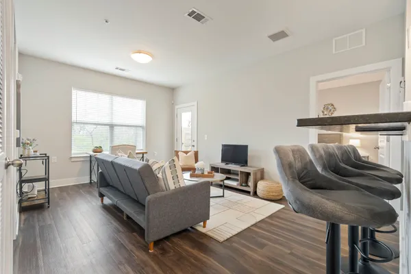 a living room with furniture and a window