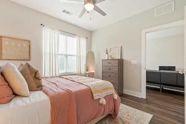 a bedroom with a bed and a couch