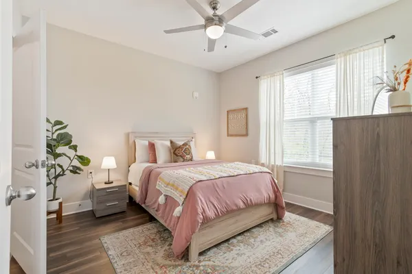 a bedroom with a bed and window