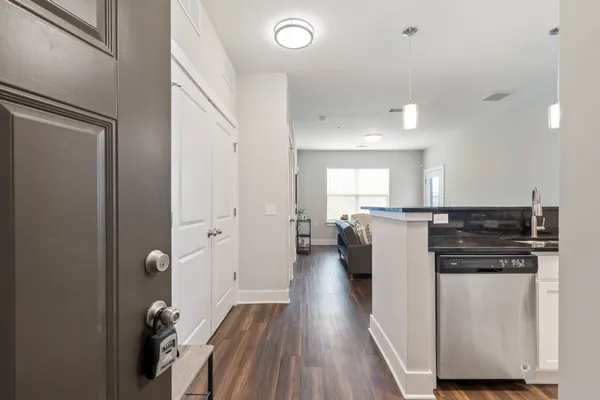 a kitchen with stainless steel appliances granite countertop a refrigerator and a stove