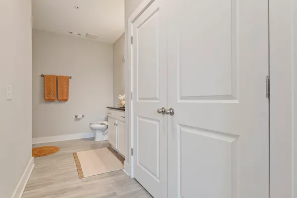 a bathroom with a toilet and a shower