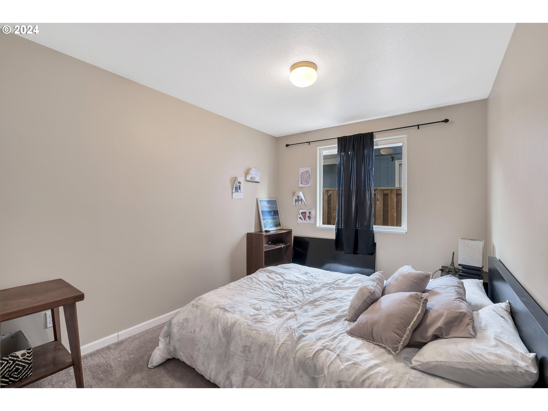 325 Cosmo Street Lafayette, OR 97127 - Photo 14 of 29 a bedroom with a bed and a chair